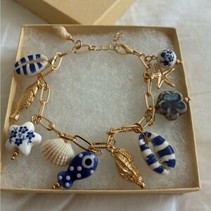 Gold Charm Bracelet with Blue & White Porcelain Charms